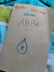A card saying "Happy Birthday Drupal Abba"